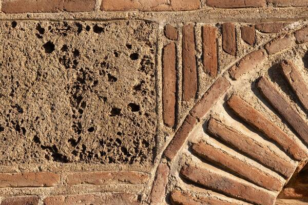 Wall made of brick and hewn stone