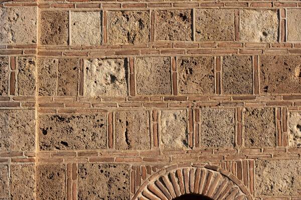 Wall made of brick and hewn stone