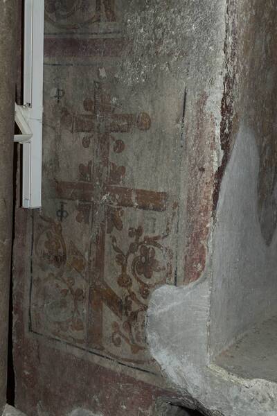 Flowered cross with a cryptogram in the bifore window