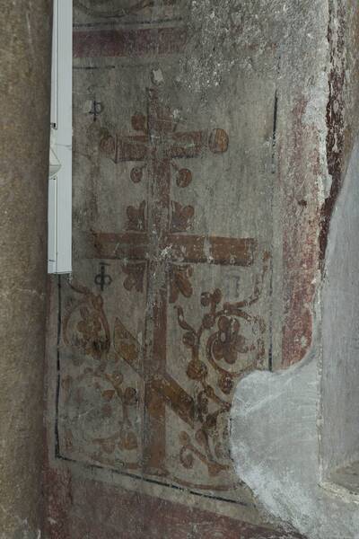 Flowered cross with a cryptogram in the bifore window