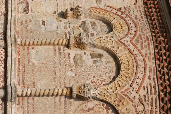 Painted rosettes under the blind arcade of the altar apse