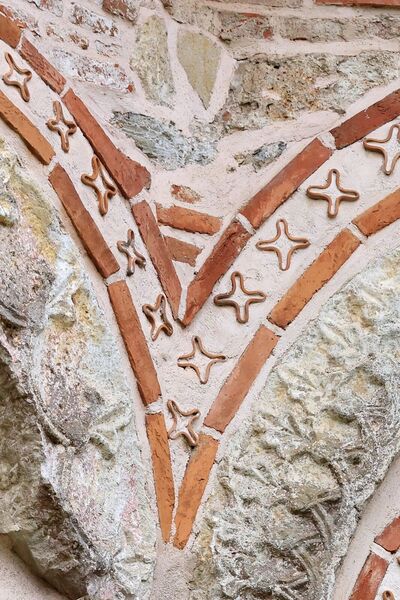 Ceramoplastic decoration along the western rosette of the northern facade of the nave