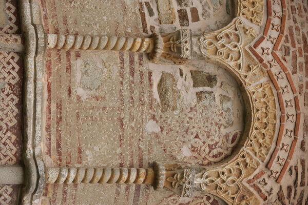 Painted rosettes under the blind arcade of the altar apse