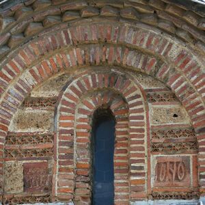 Tympanum below the southeast dome, brick inscription