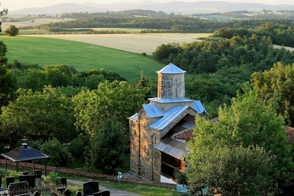 View of the Church and the Slopes of the Rudnik Mountain