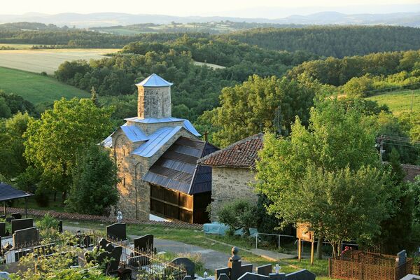 View of the Church and the Slopes of the Rudnik Mountain