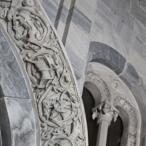 A sculpture of griffin on the capital on the south side of the portal