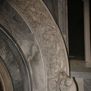 A sculpture of griffin on the capital on the south side of the portal