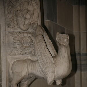 A sculpture of griffin on the capital on the south side of the portal